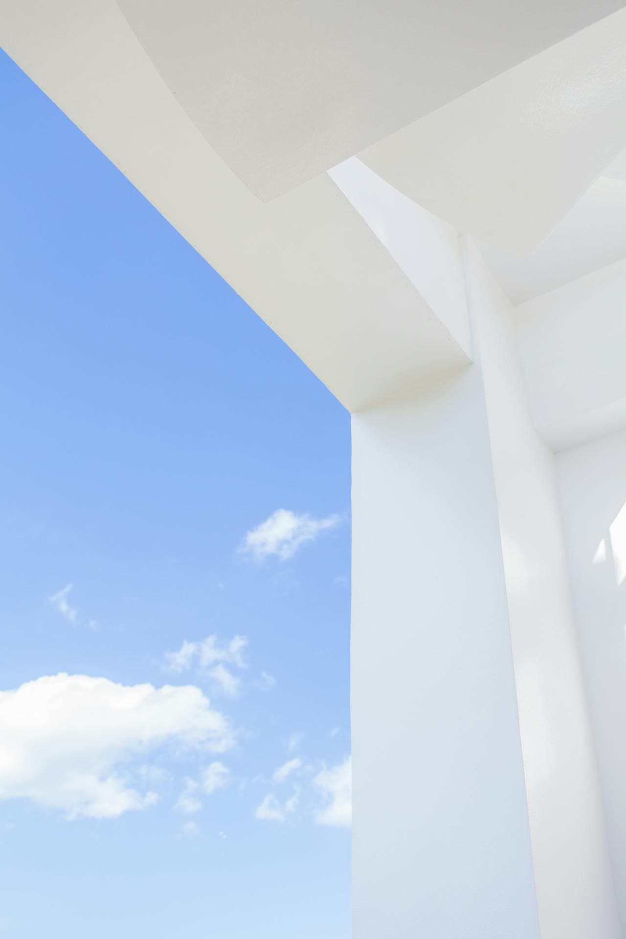 simplicity image of a white building and a blue sky